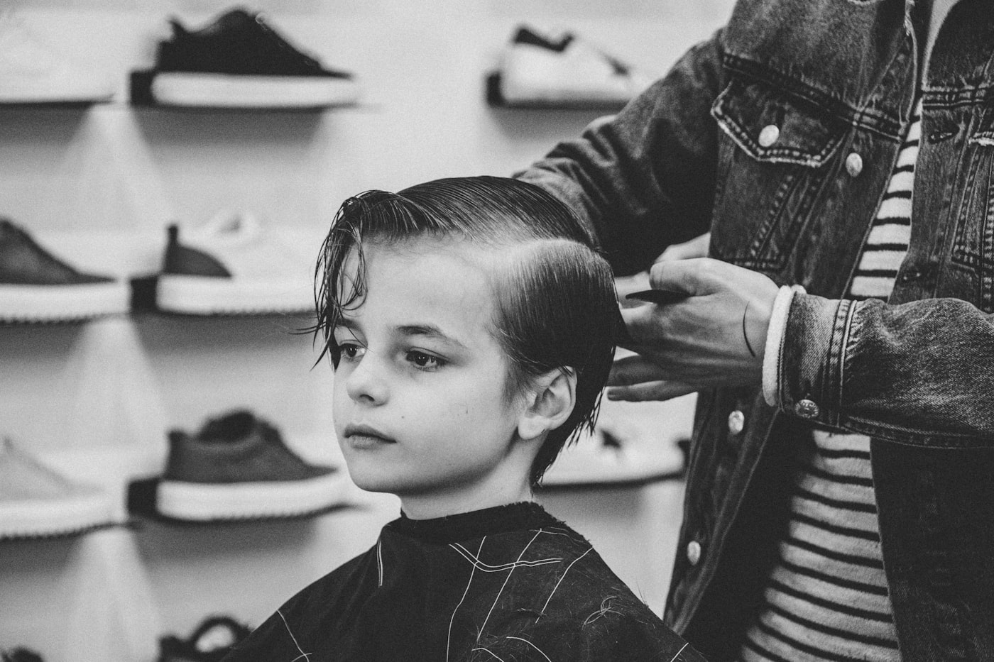Barber working with a client in the chair